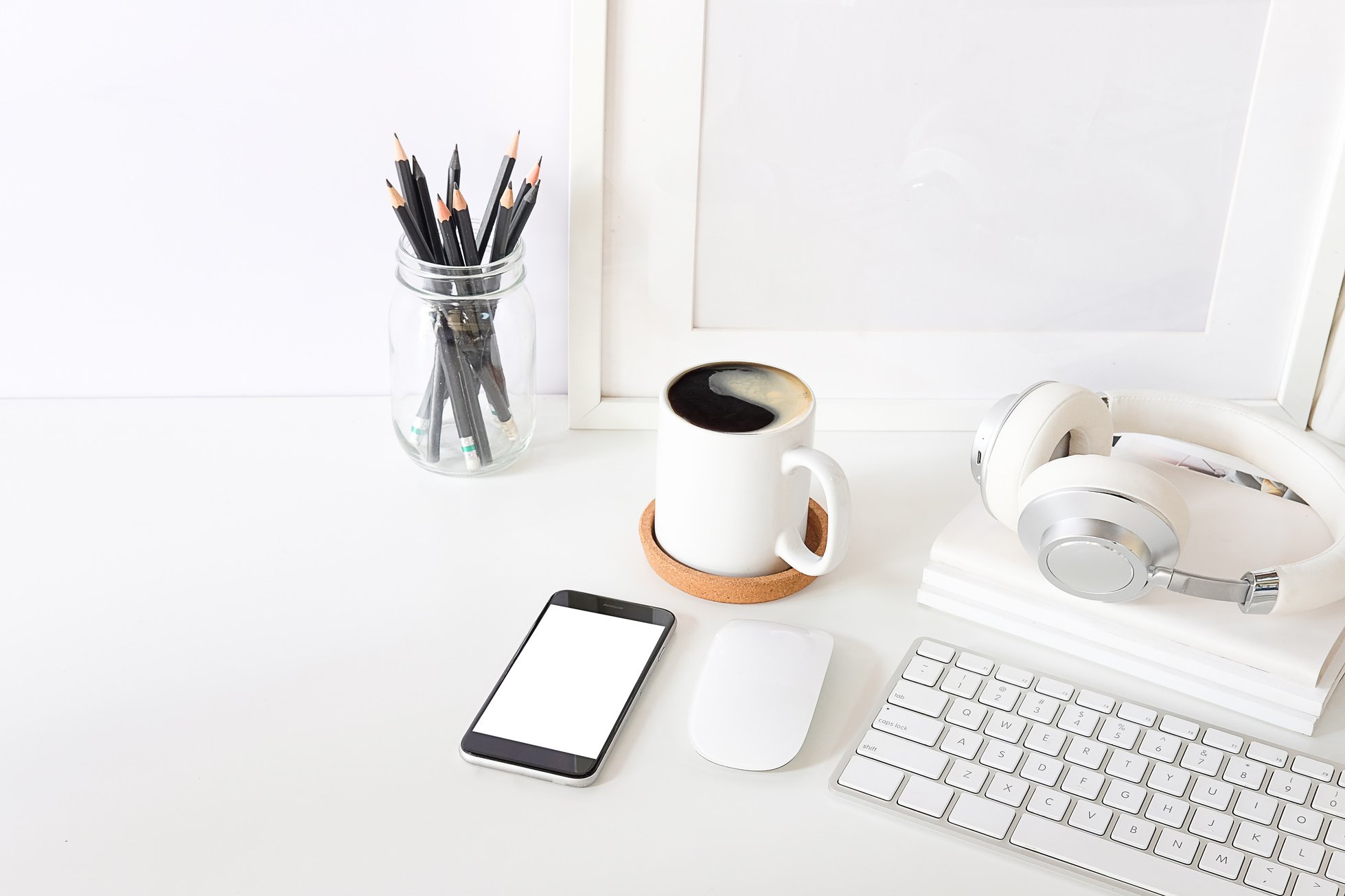 Smartphone, Coffee Cup, and Computer on a Desk